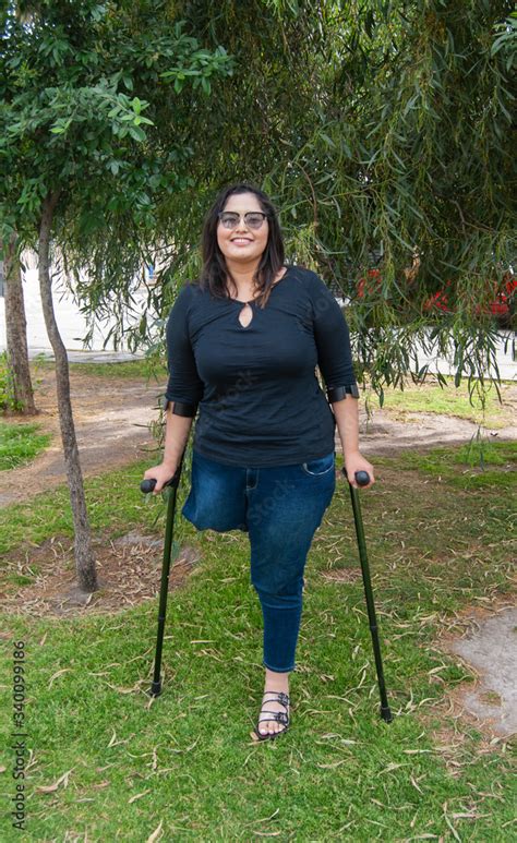 amputee woman on crutches|female amputee on underarm crutches.